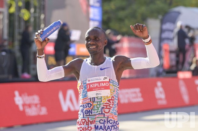 Jacob Kiplimo raises the Ugandan Flag High at the Chicago Marathon
